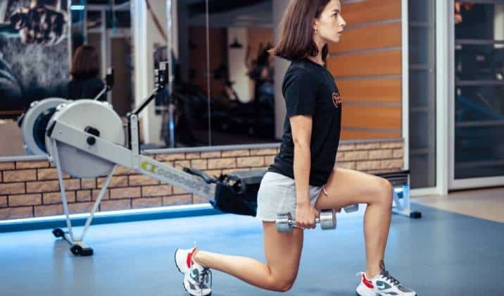 forward lunge - lower body dumbbell exercises for weight loss