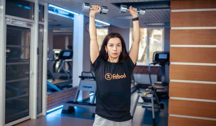 standing shoulder press - upper body dumbbell exercises for weight loss